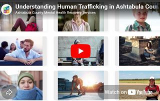 A grid of nine diverse portraits featuring people of different ages and backgrounds, overlaid with a YouTube play button and text reading "Understanding Human Trafficking in Ashtabula County."